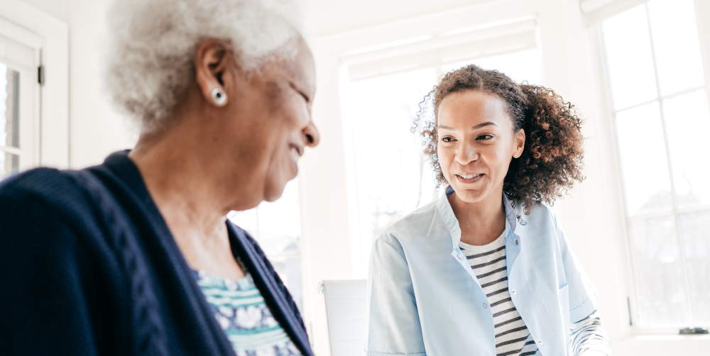 Working for an agency, like this caregiver who’s with a client, can be a choice that leads to a good job.
