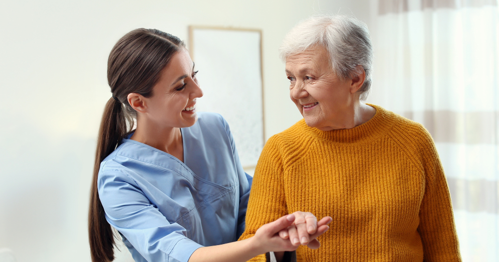 Professional caregivers, like this one who is helping a senior client walk, require a number of qualities and skills to provide compassionate personal care.