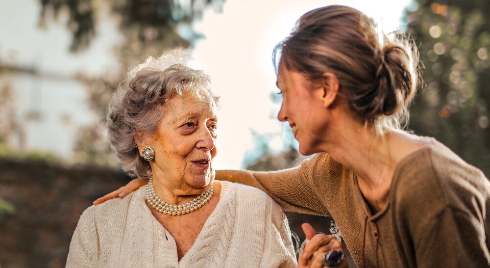 A daughter has a nice conversation with her older mother, showing the kind of conversation caregivers want to have with aging loved ones.