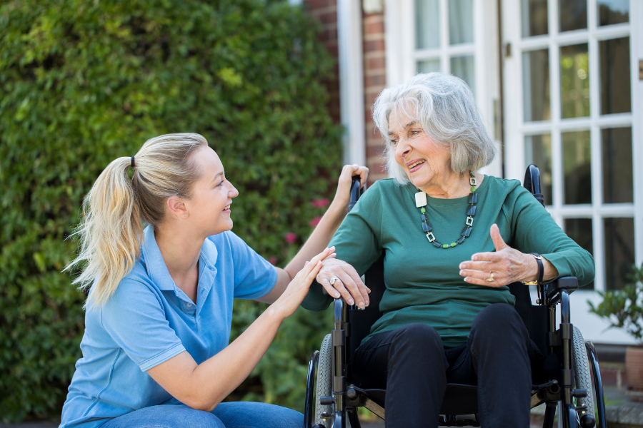 Home Care in Marco Island A care giver assists an elderly patient outside in a wheel chair. Home Care in Marco Island