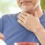 An older adult holds his throat representing dysphagia which can affect senior health.