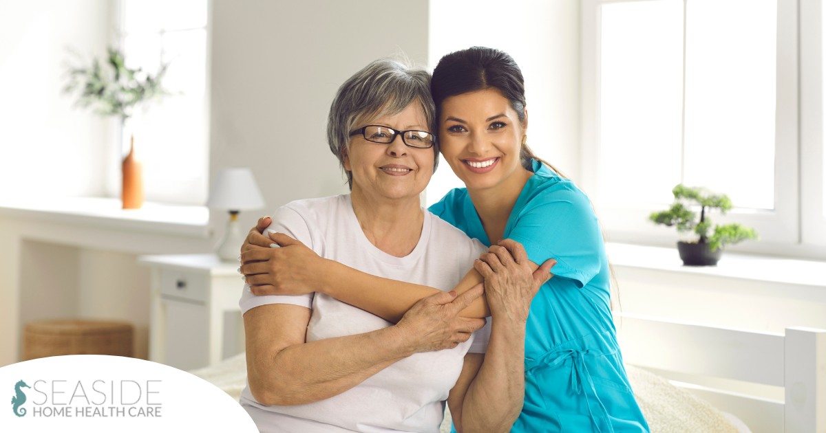 A caregiver hugs an older client, representing how a trustworthy caregiver cares for clients.